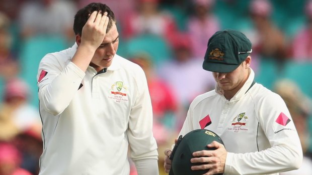 Concussion concern: Matt Renshaw was hit on the helmet while fielding with skipper Steve Smith during the Third Test against Pakistan.