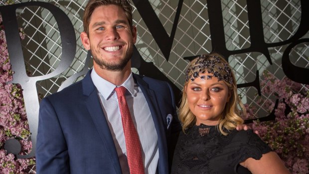 Geelong player Tom Hawkins and his wife, Emma, are celebrating the return of Emma's stolen wedding dresses.