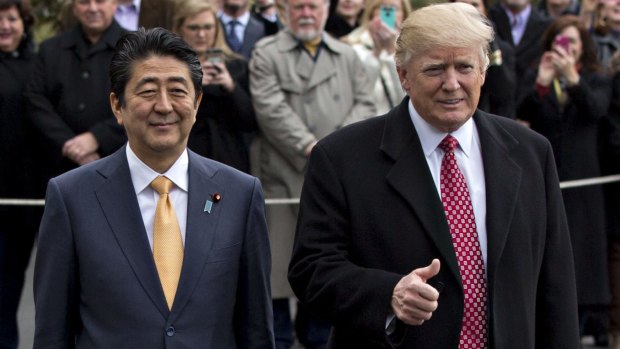 US President Donald Trump gives the thumbs up to his meeting with Japanese Prime Minister Shinzo Abe.