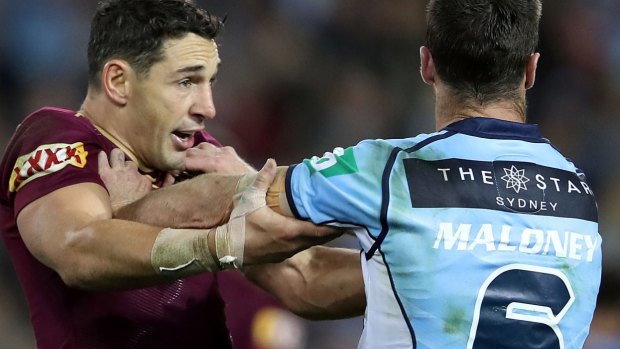 Rivals: Billy Slater and James Maloney clash during Origin II.