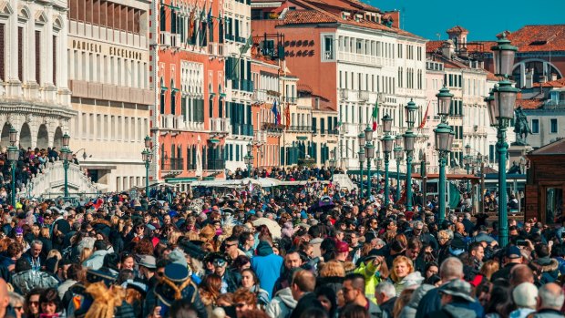 Crowds of tourists near San Marco Square, Venice.