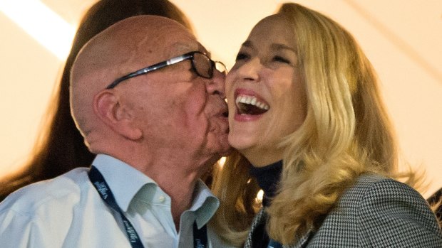 Rupert Murdoch plants a kiss on Jerry Hall's cheek at the Rugby World Cup final in London last weekend.