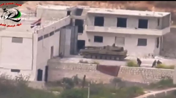 Footage supplied by the Free Syrian Army's Fursan al-Haq Brigade shows a Syrian tank near Ariha, in Syria's Idlib province, moments before a TOW missile strike.