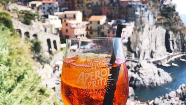 Picturesque views with a drink in hand make for a quintessential Italian aperitivo experience.