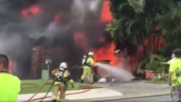 A home is on fire on KP McGrath Drive, Elanora, on the Gold Coast.