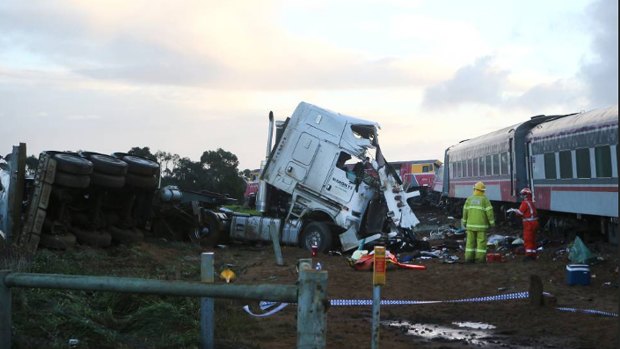 Emergency services survey the crash scene. Picture: Amy Paton