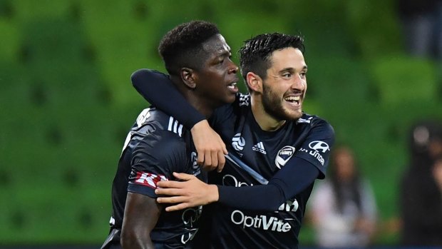 Leroy George celebrates a goal with Stefan Nigro.