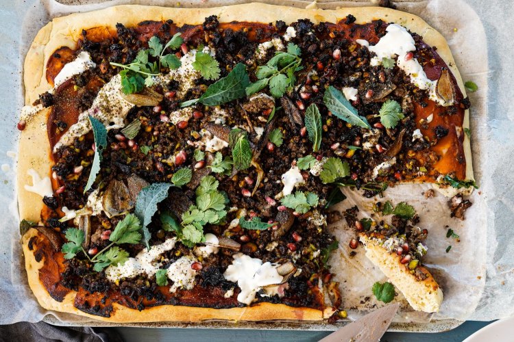 Lamb, maple, sumac and pistachio 'pizza' with tahini yoghurt and charred onions.