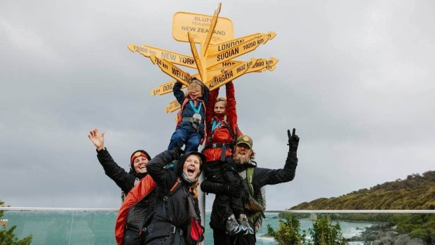 Tom and Deanna Gerlach and kids ham it up in Bluff after reaching Bluff on the Te Araroa Trail.