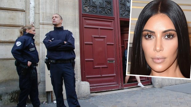 French police officers stand outside the residence of Kim Kardashian West in Paris.