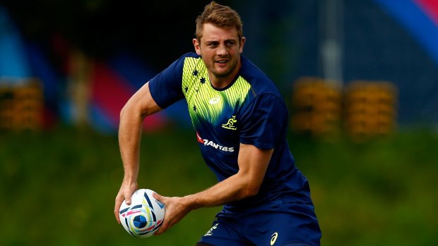 Pass the ball dad .... Dean Mumm missed the Wallabies' training session in Bath on Friday to be by his wife's side after the birth of their baby boy.