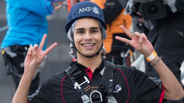 Isaiah Firebrace descends on a zipline from the AMP tower in Sydney on Friday.