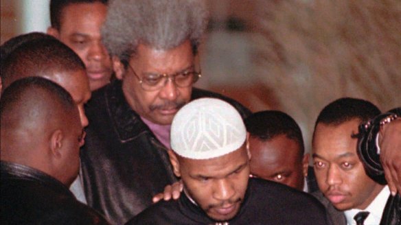 Former heavyweight champion Mike Tyson enters a limousine in front of Don King as he is released from the Indiana Youth Centre in Plainfield in 1995. Tyson was convicted for the 1991 rape of Miss Black America contestant Desiree Washington in an Indianapolis hotel.