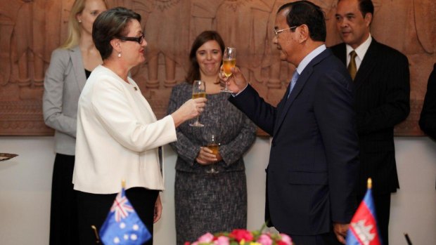Australia's ambassador to Cambodia Angela Corcoran and Cambodian Minister of Foreign Affairs Prak Sokhonn toast the upgraded relationship in Phnom Penh on Wednesday