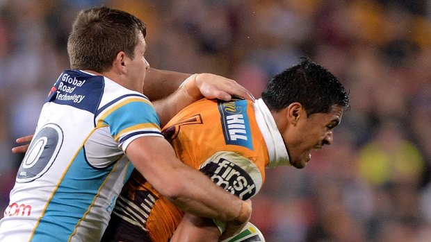 Anthony Milford attempts to break away from the defence during the Broncos round 20 match against the Gold Coast Titans.