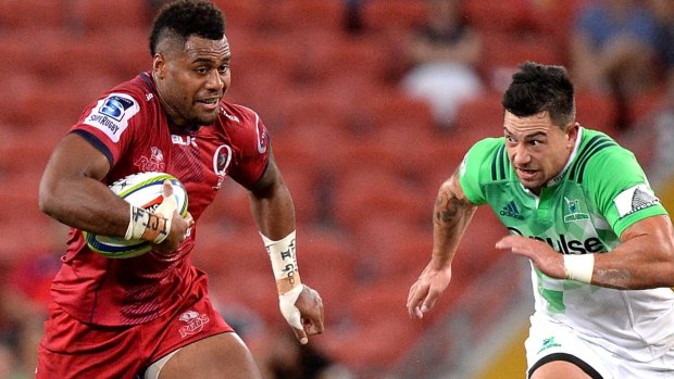 Red on the rampage:  Samu Kerevi  breaks through the Highlanders defence 