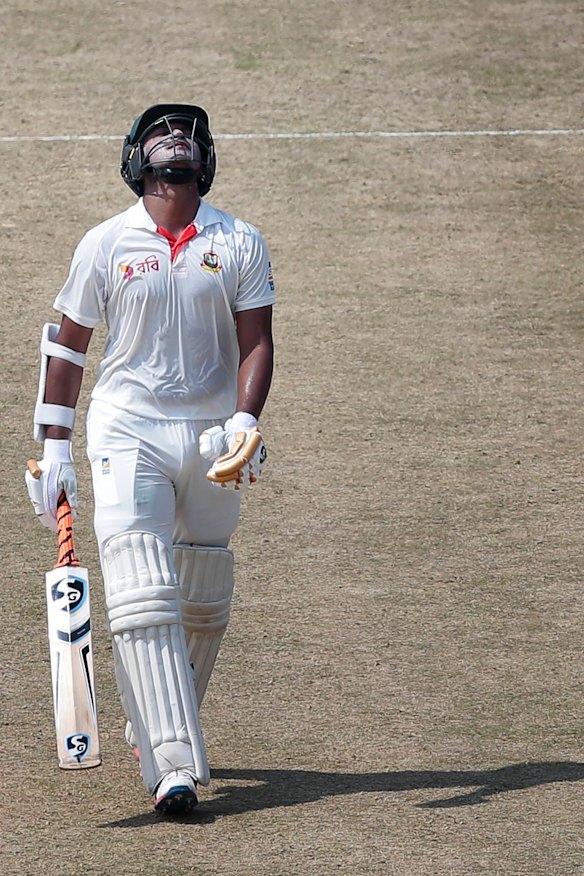 Bangladesh's Shakib Al Hasan walks back to the pavilion after his dismissal by Ashton Agar.