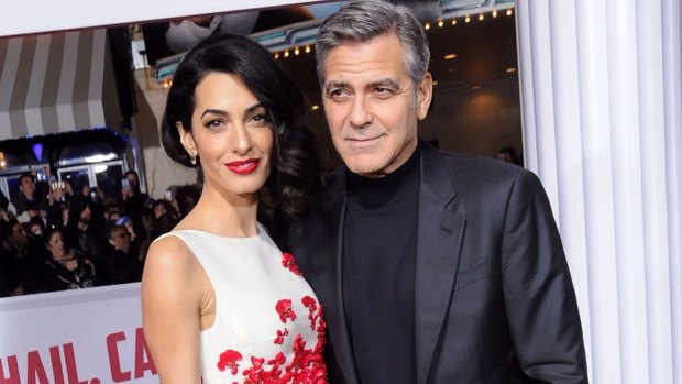 Lawyer Amal Clooney, with husband George, was to headline the Women World Changers summit in Australia in October.