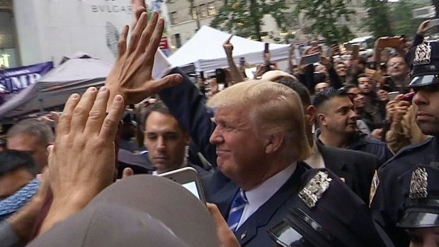 Donald Trump greets supporters outside Trump Tower on Saturday.