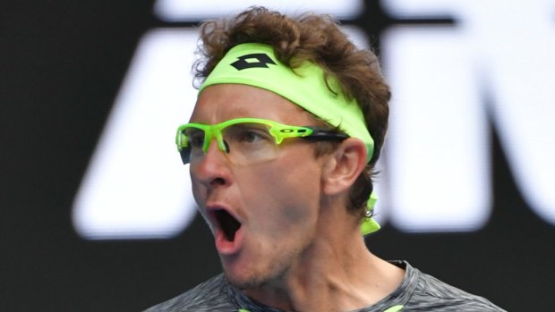 Colourful: Denis Istomin is hard to miss with his eye-catching glasses and bandana.