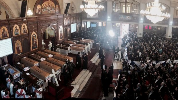 Coffins are laid out during a service for victims of the December cathedral bombing in Cairo.