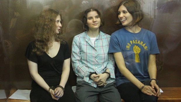 Maria Alyokhina, left, with fellow Pussy Riot members Yekaterina Samutsevich and Nadezhda Tolokonnikova after their sentencing in Moscow in 2012.