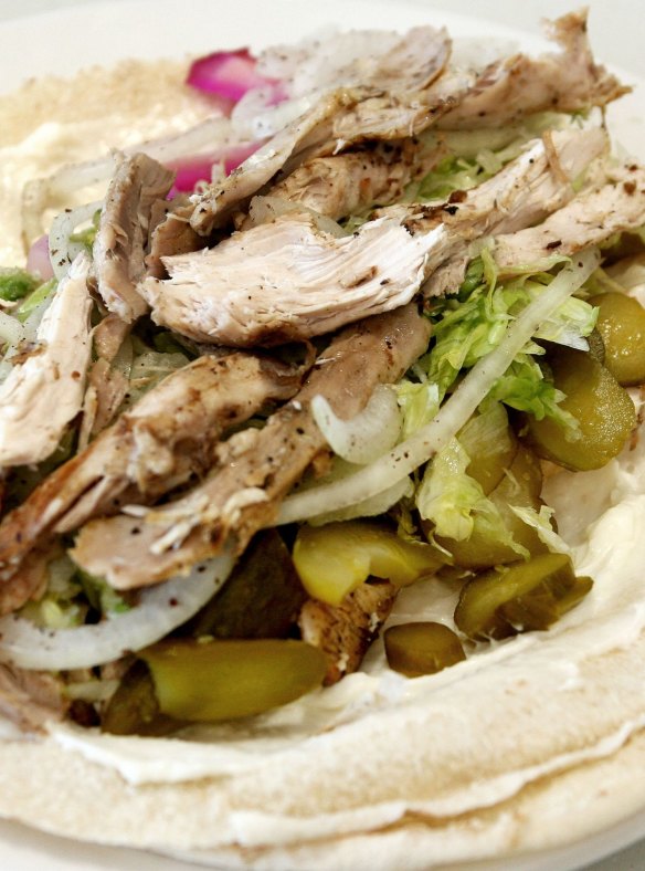 El Jannah's Lebanese charcoal chicken with pita, hummus, pickles and garlic sauce.