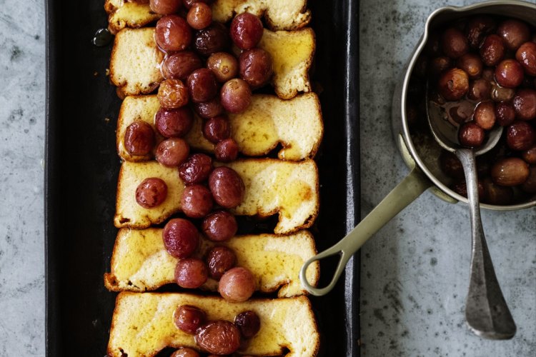 Honey baked ricotta with roasted red grapes.