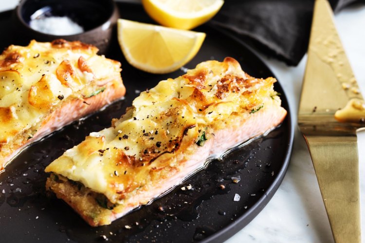 Herb-crusted ocean trout with potato gratin.