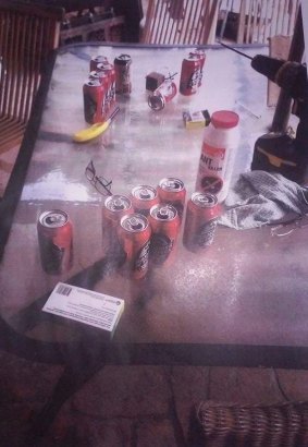Photographs taken by police show beer cans and other items strewn throughout the home.