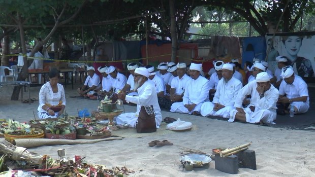 Kuta villagers hold a ceremony at the crime scene to cleanse the area.