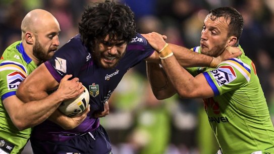 Green wall: Tohu Harris takes on the Canberra Raiders at GIO Stadium.