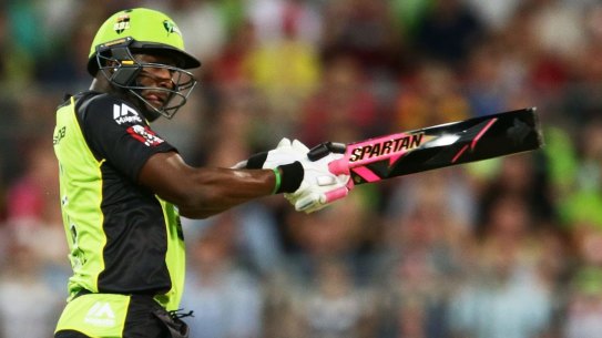 Integrity concern: Andre Russell of the Thunder wields the colourful bat against the Sixers at Spotless Stadium.