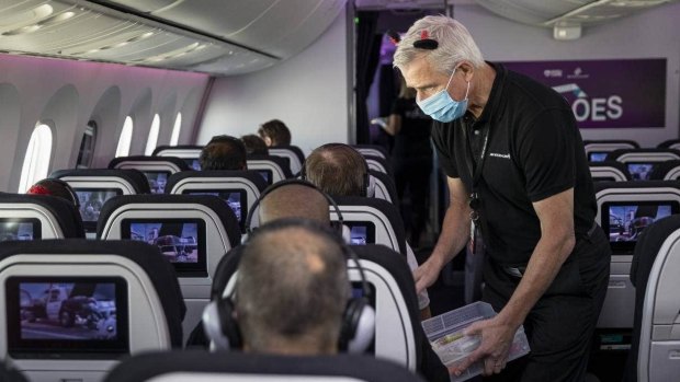 Air New Zealand chief executive Greg Foran hands out ice blocks on Saturday's flight.