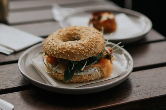 Bagels are filled with smoked salmon and cream cheese or pastrami and crisp potato straws.