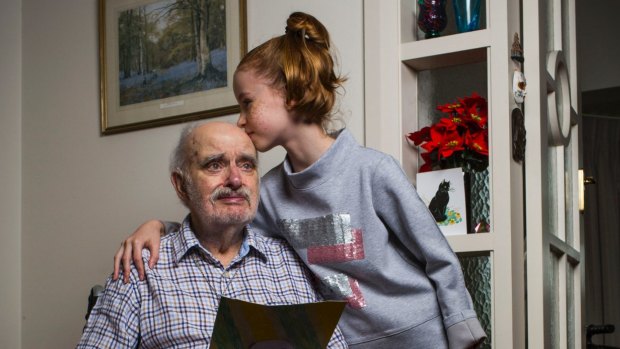Grandfather James Bradley, 92, and his granddaughter Karis Town, 9, at home in Croydon.