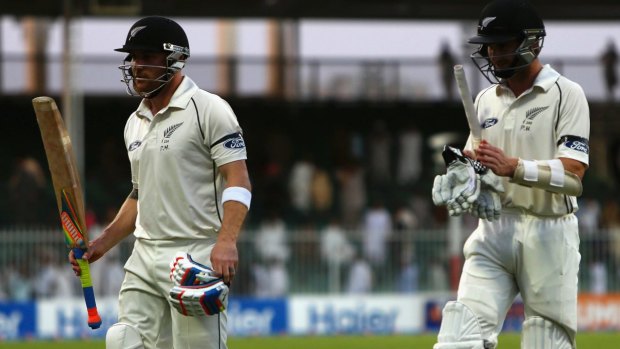 BLISTERING KNOCK: Brendon McCullum (left) acknowledges the applause as he and Kane Williamson leave the field at stumps on day two.