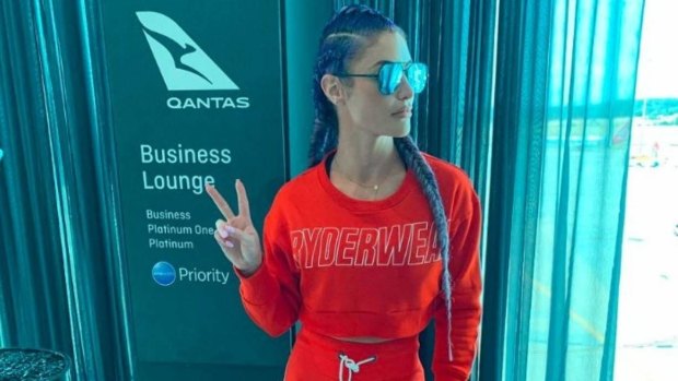 Former WWE wrestler Natalie Eva Marie - dressed in activewear - was refused entry to Qantas business lounge.