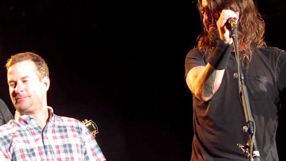 'Anthony the crying fan' is overcome and has to look away while on stage with Dave Grohl and the Foo Fighters in Colorado this week.