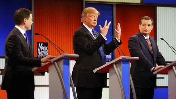 Republican presidential candidate Donald Trump, shows his hands during Thursday's Republican debate while Senators Marco Rubio (Left) and Ted Cruz (right) look on.