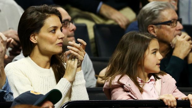 Katie Homes and daughter Suri Cruise watching a basketball tournament last year.