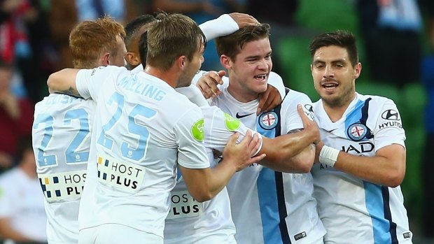 Connor Chapman of Melbourne City celebrates with teammates after scoring a goal against Perth Glory.