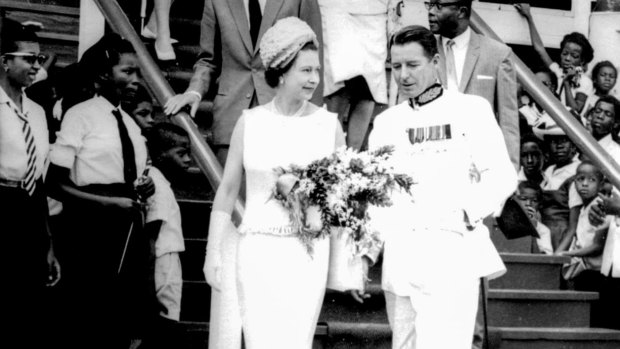 Sir Ian Turbott with Queen Elizabeth ll in Grenada.