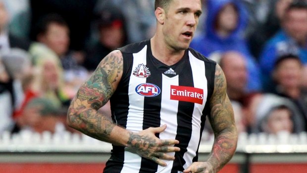 Dane Swan rubs his allegedly expanding stomach on Anzac Day in 2012.