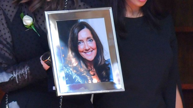 Karen Ristevski's daughter Sarah carried a photograph of her mother at the funeral.