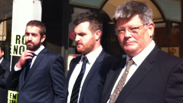 Brothers Patrick Lyttle (left), Barry Lyttle (centre) and barrister Chris Watson outside court.