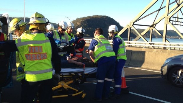 A woman, 29, who is seven months pregnant, has been airlifted to a hospital after her car was hit by a truck on the M1 Pacific Motorway.