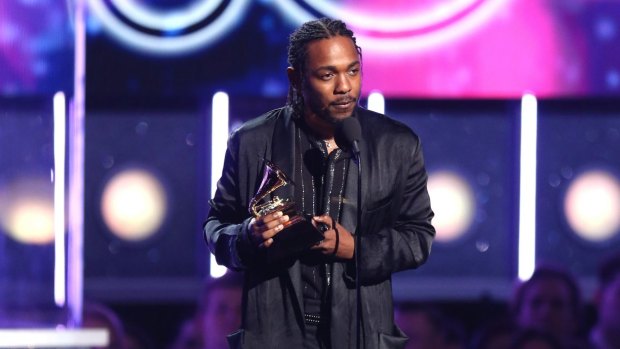 Kendrick Lamar accepts the award for best rap album for "Damn".