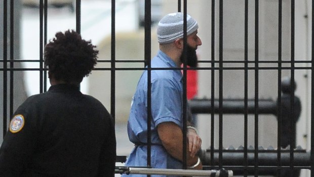 Adnan Syed walks into the court in Baltimore before a hearing on Wednesday. 