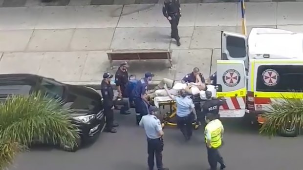 Television footage of the injured officer being taken to hospital. 